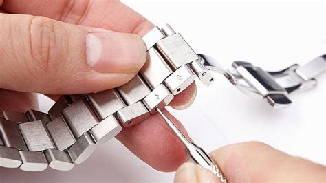 how to remove links from a stretch watch band|removing watch links with arrows.